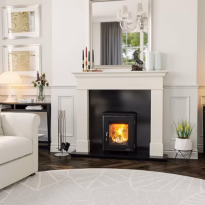 Renoir fireplace surround shown in a styled interior setting.