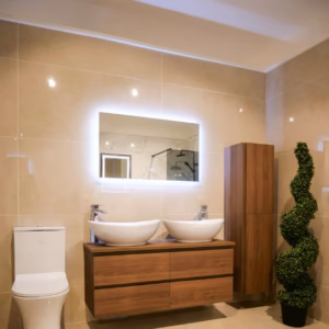 Landscape LED vanity mirror above a double basin bathroom unit