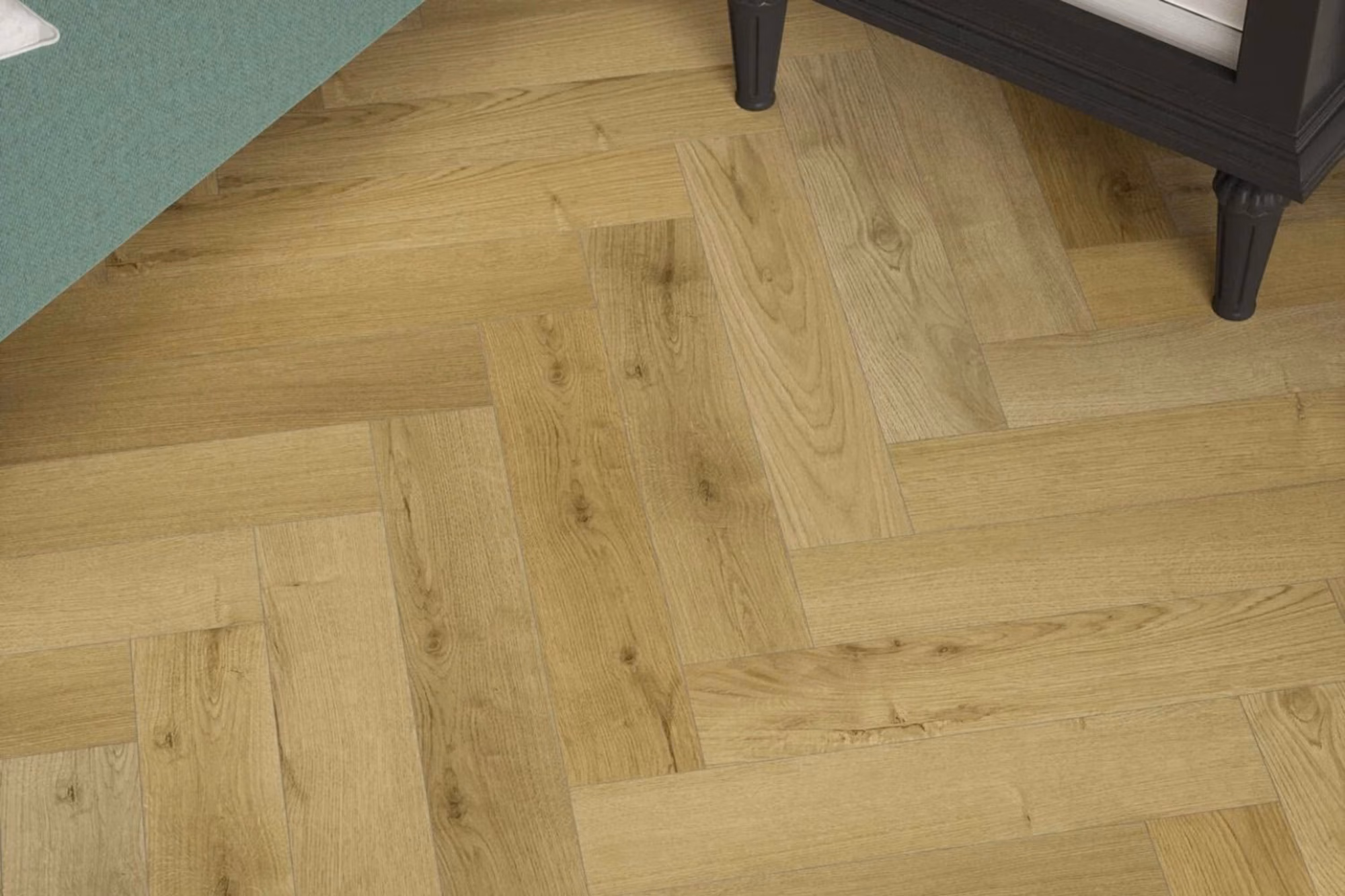 Privas Oak Herringbone laminate flooring with four-sided v-groove detail.